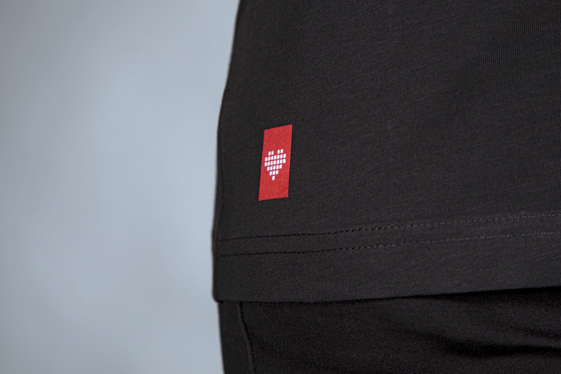 joyclub_badge_on_black_shirt